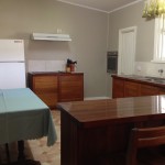Self contained kitchen with breakfast bar.